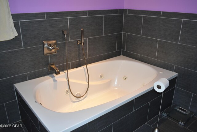 bathroom with vanity and tile walls