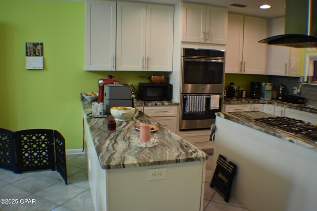 kitchen featuring white cabinets, stainless steel dishwasher, sink, and backsplash