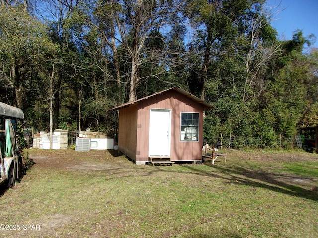 view of outbuilding featuring a yard