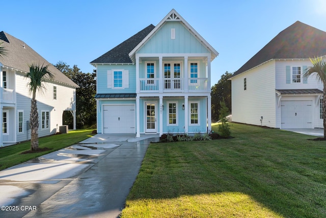 view of front of property featuring a front yard, central AC unit, and a garage