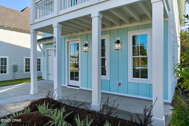 doorway to property featuring a balcony