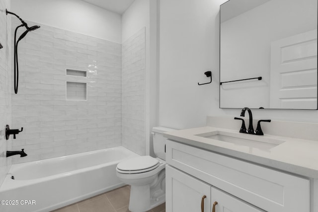 full bathroom featuring toilet, tile patterned flooring, tiled shower / bath, and vanity