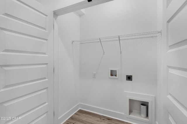 clothes washing area featuring hookup for an electric dryer, hookup for a washing machine, and hardwood / wood-style flooring