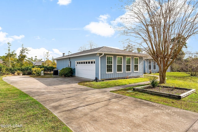 ranch-style home featuring a front yard, a garage, and central AC unit