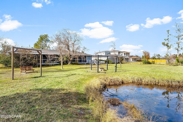 view of yard featuring a water view and a gazebo