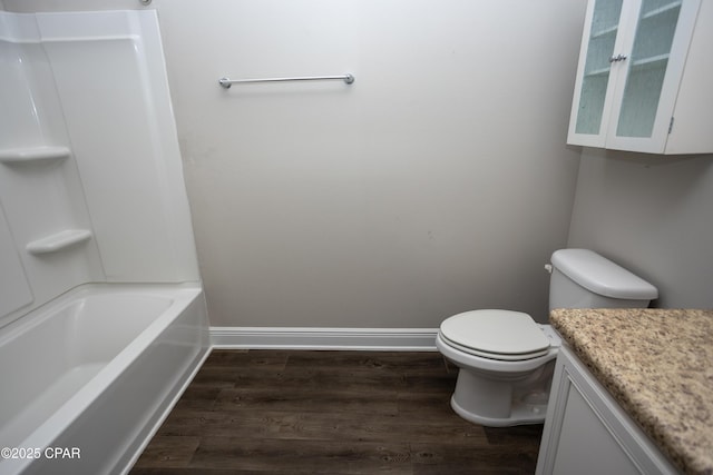 full bathroom with toilet, vanity, shower / bathtub combination, and hardwood / wood-style flooring