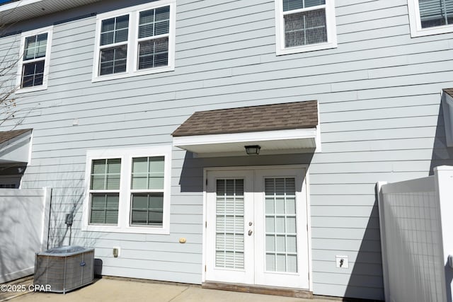 property entrance featuring central AC and french doors