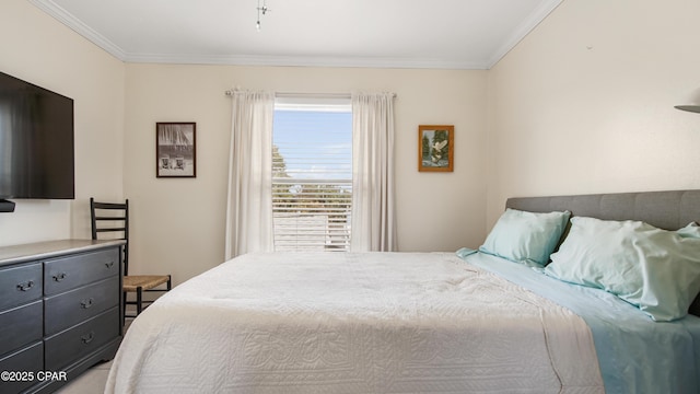 bedroom with crown molding and multiple windows