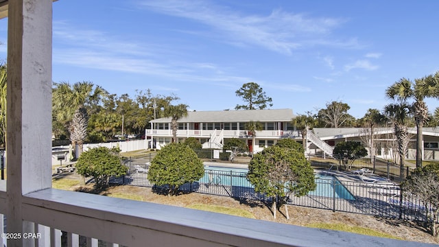 view of building exterior with a community pool