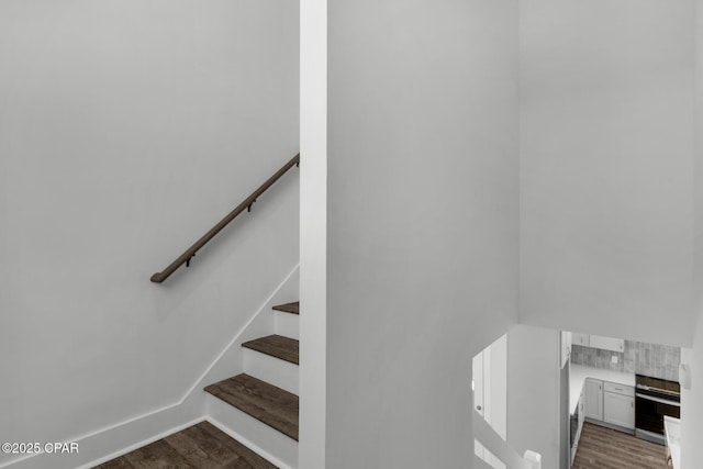 staircase featuring hardwood / wood-style flooring