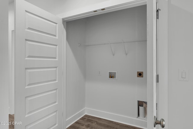 washroom with hookup for a washing machine, dark hardwood / wood-style floors, and hookup for an electric dryer