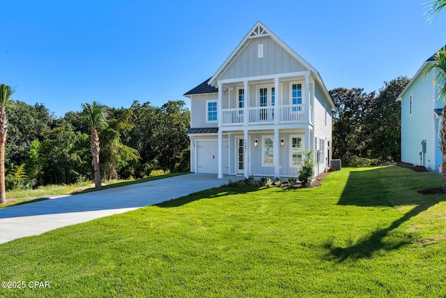 view of front of house featuring a front yard, a garage, and central AC unit