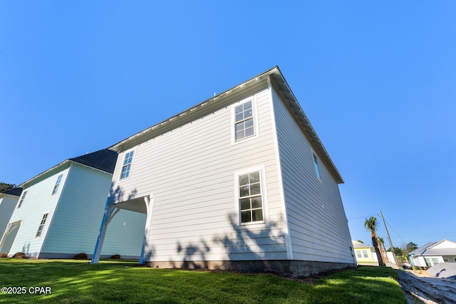 rear view of property with a yard