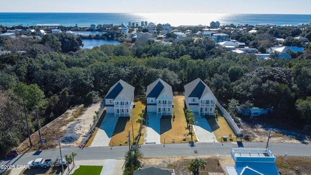 birds eye view of property with a water view