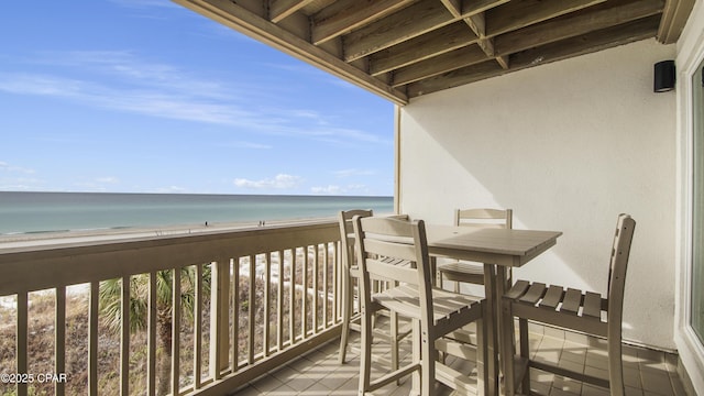 balcony with a view of the beach and a water view