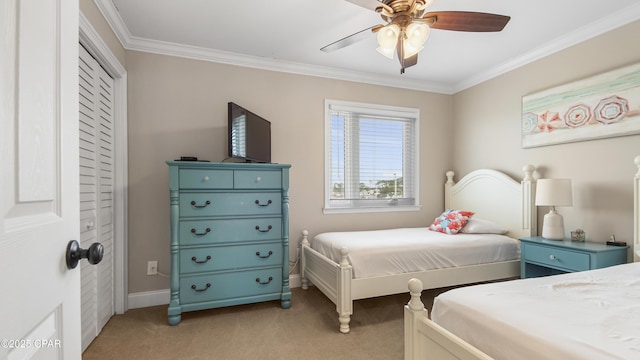 bedroom featuring crown molding, light colored carpet, and ceiling fan