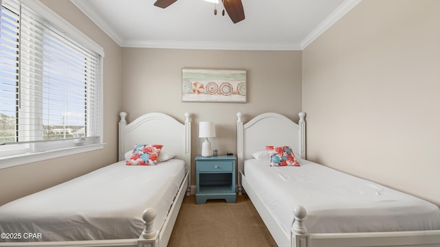 bedroom with crown molding, dark carpet, and ceiling fan