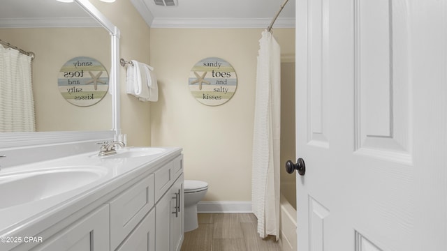 full bathroom featuring toilet, ornamental molding, vanity, shower / bath combo with shower curtain, and hardwood / wood-style floors