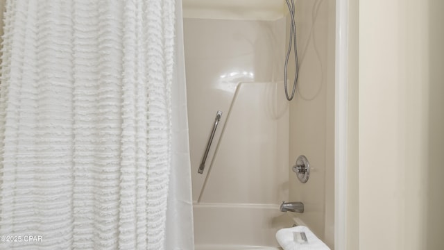 bathroom featuring shower / tub combo with curtain