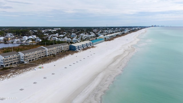 birds eye view of property with a view of the beach and a water view