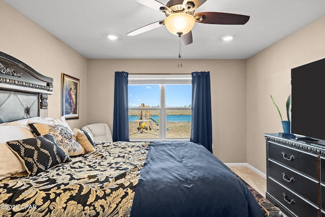 bedroom with ceiling fan and carpet floors