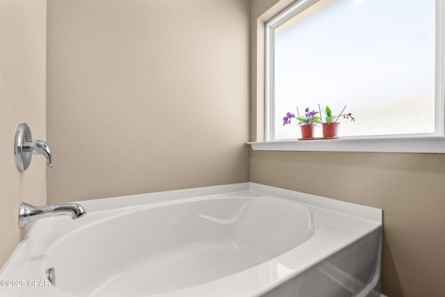 bathroom featuring a tub to relax in