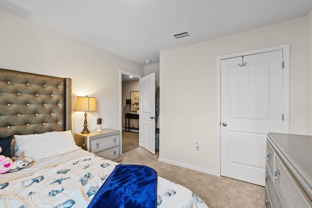 carpeted bedroom featuring a closet