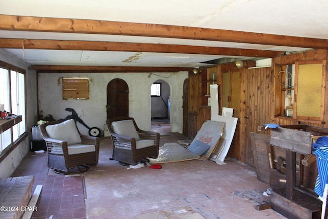 living room featuring beam ceiling