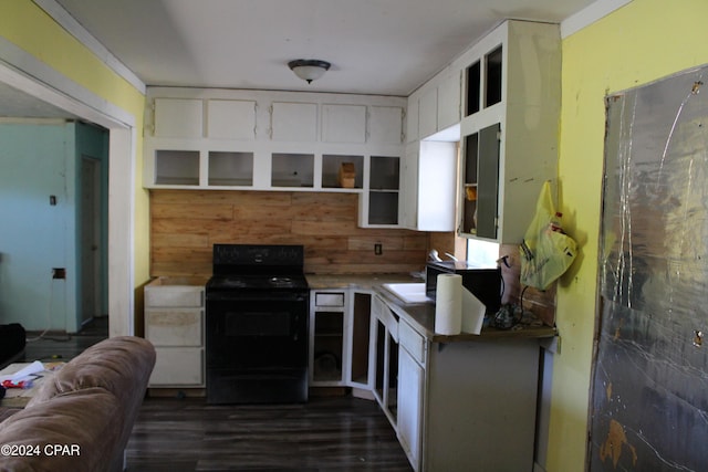 kitchen featuring black range with electric stovetop, sink, white cabinets, and dark hardwood / wood-style floors