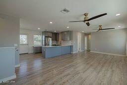 interior space featuring ceiling fan and wood-type flooring