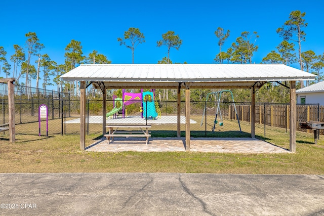 exterior space featuring a playground and a lawn