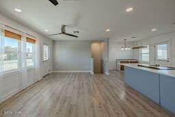 kitchen with ceiling fan, light wood-type flooring, and a wealth of natural light