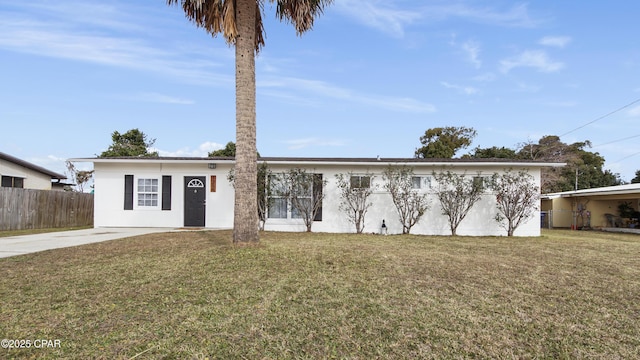 ranch-style home featuring a front yard