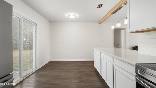 kitchen featuring tasteful backsplash, white cabinetry, beamed ceiling, dark hardwood / wood-style flooring, and hanging light fixtures