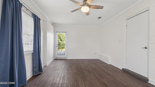 empty room with ceiling fan, ornamental molding, dark hardwood / wood-style flooring, and a textured ceiling