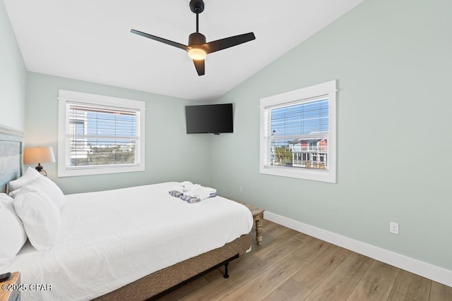 bedroom featuring vaulted ceiling, ceiling fan, and light hardwood / wood-style floors