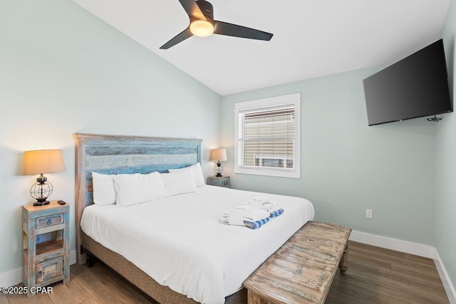 bedroom featuring ceiling fan, lofted ceiling, and wood-type flooring