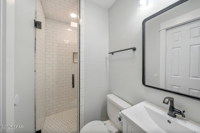 bathroom featuring walk in shower, sink, and toilet