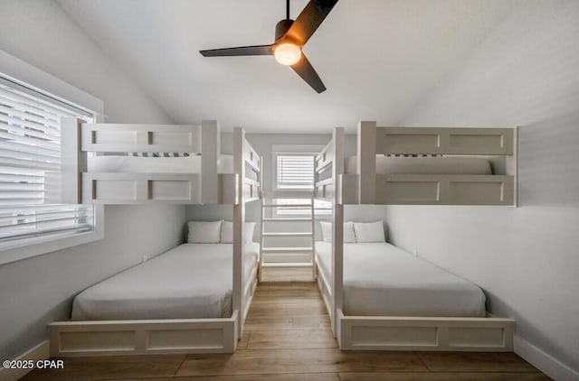 bedroom with ceiling fan and hardwood / wood-style flooring