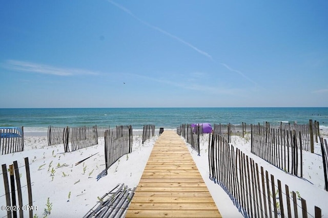 exterior space featuring a beach view and a water view