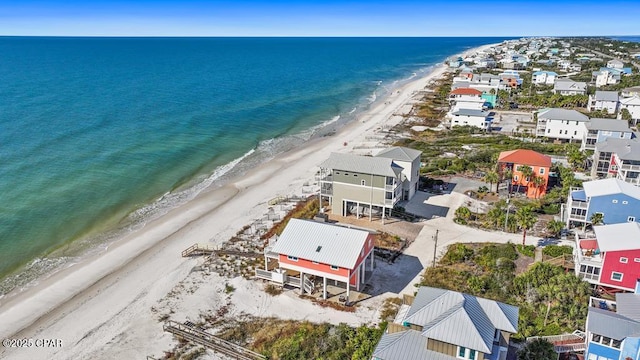 bird's eye view featuring a water view and a view of the beach