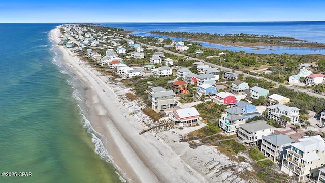 bird's eye view with a water view and a view of the beach