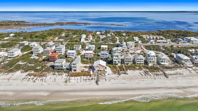 aerial view featuring a water view and a view of the beach