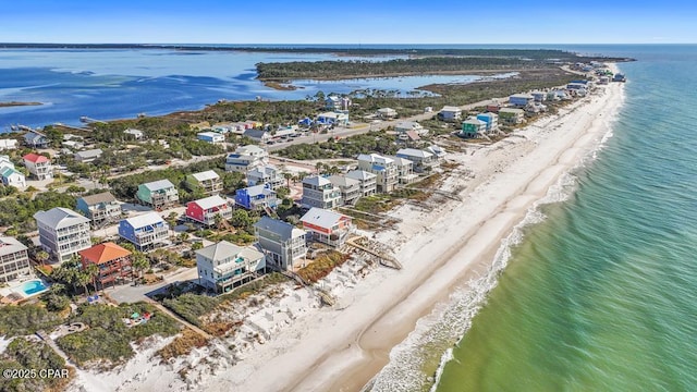 birds eye view of property featuring a view of the beach and a water view