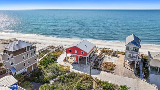 drone / aerial view featuring a view of the beach and a water view