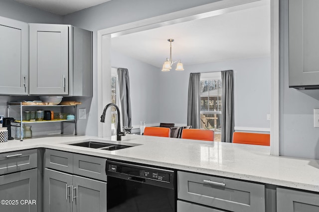 kitchen featuring sink, a chandelier, gray cabinets, black dishwasher, and light stone countertops