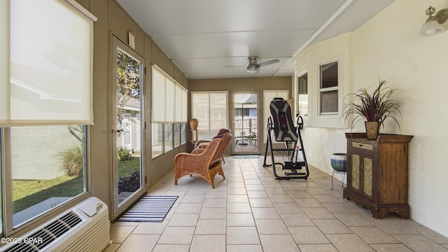 sunroom with ceiling fan