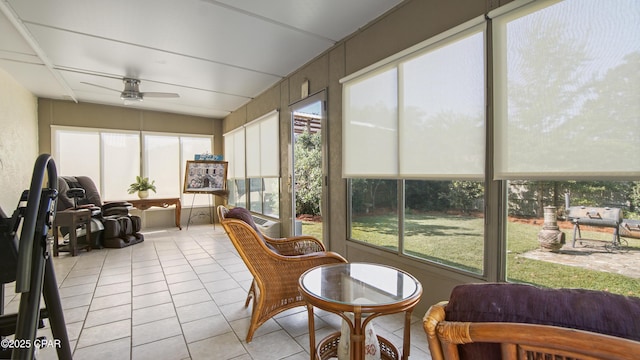 sunroom with ceiling fan and a healthy amount of sunlight