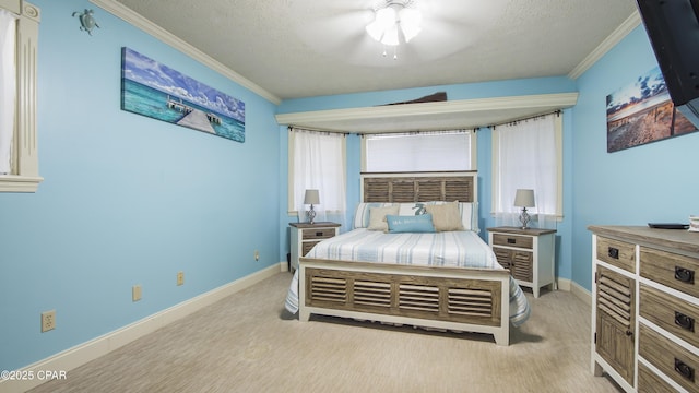 bedroom with ceiling fan, crown molding, and a textured ceiling