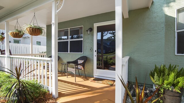 entrance to property featuring covered porch